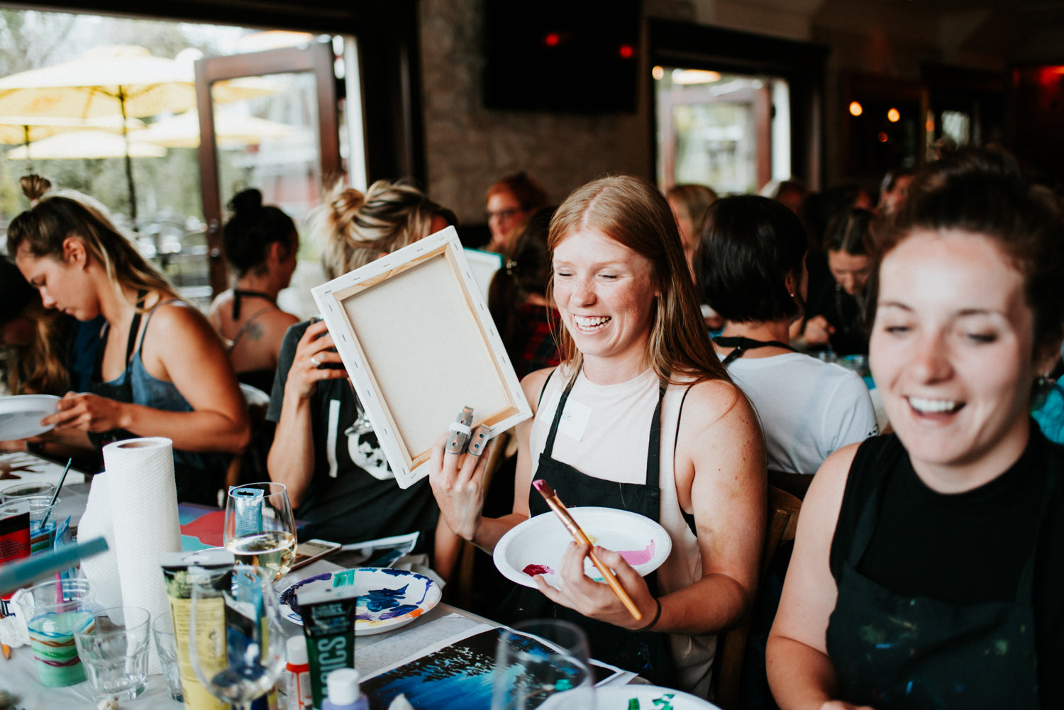 Ladies at a Paint Night run by Whistler artist Andrea Mueller