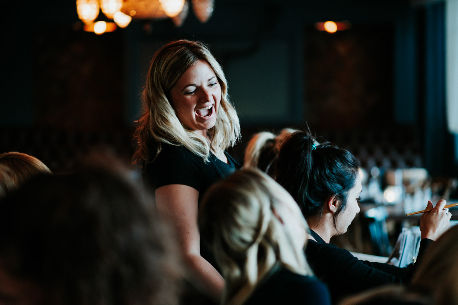 Whistler artist Andrea Mueller laughs during Paint Night