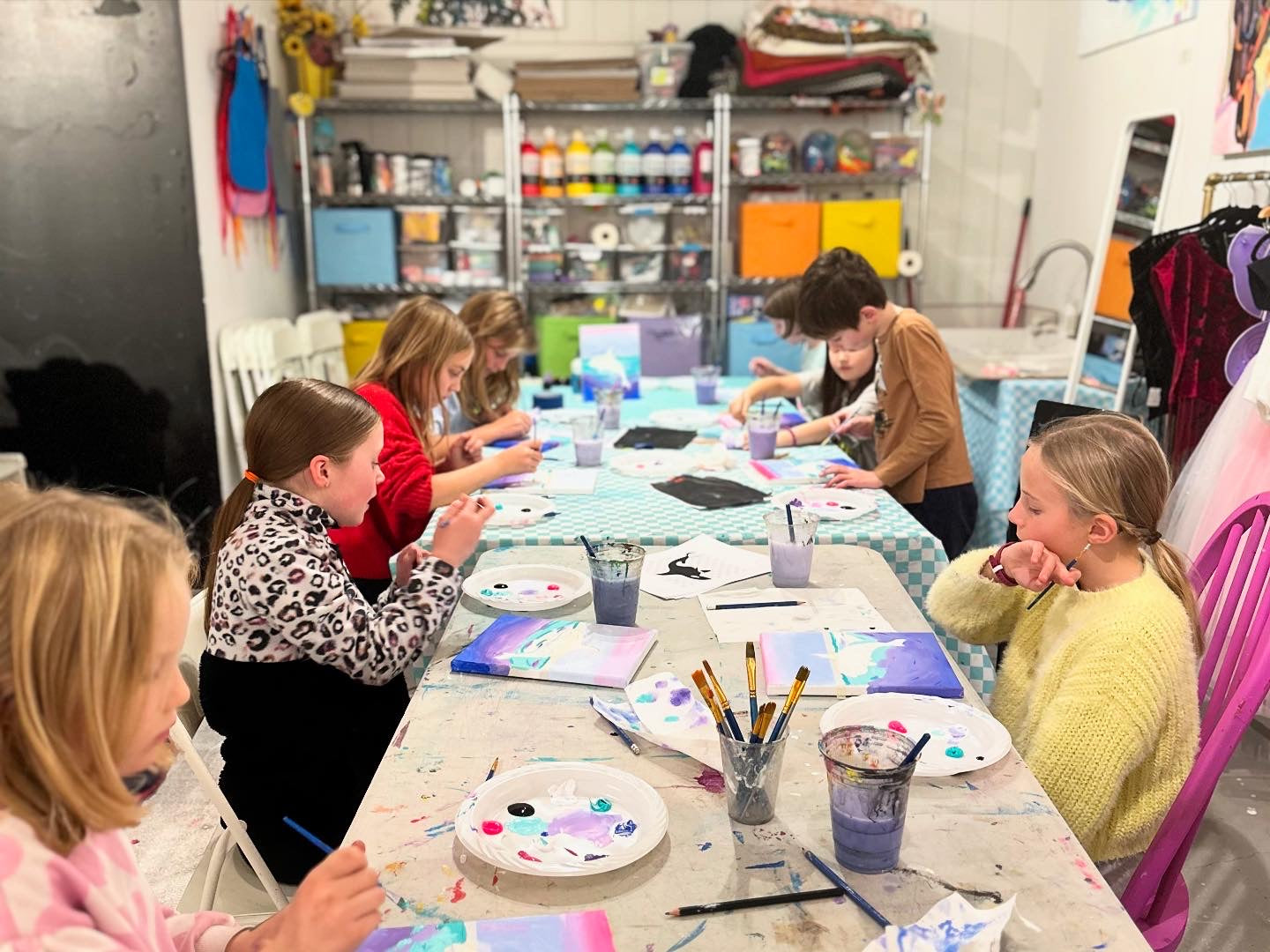 Children engaged in a painting activity at ART POP in Whistler 